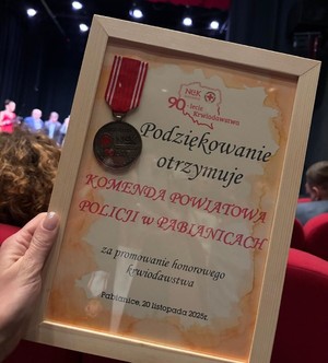 Podziękowania wraz z medalem.