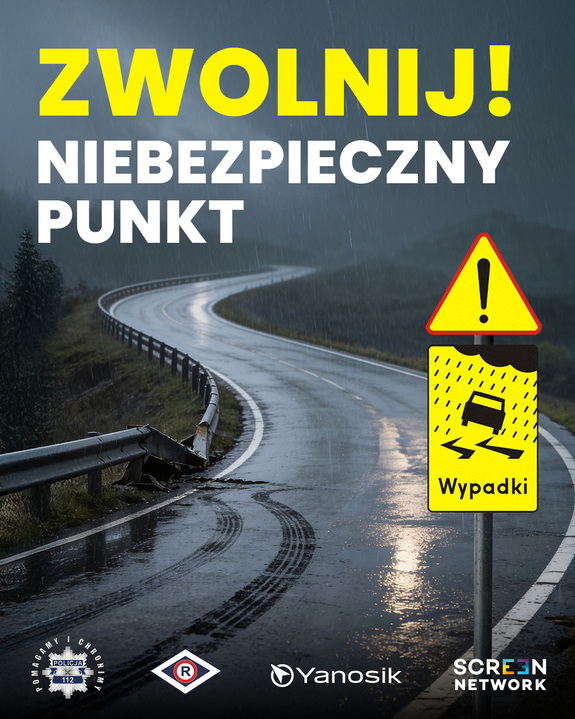 Zwolnij! Niebezpieczny punkt. W tle kręta droga